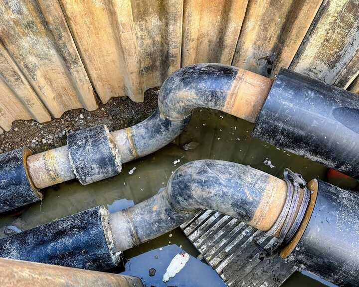 pipeline trench laid through industrial landscape